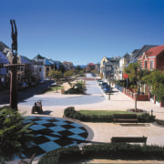 An exterior view of the homes in the city, downtown, estate, home, house, mixed use, neighbourhood, property, real estate, residential area, resort, sky, suburb, town, tree, walkway, black, blue