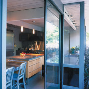 A view of a kitchen designed by Baum door, glass, house, interior design, window, gray