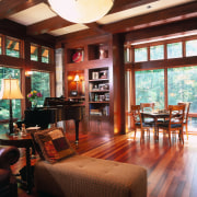 view of the lounge dining area featuring  ceiling, dining room, home, interior design, living room, real estate, room, table, window, wood, red