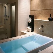 view of the soaking tub with overflow channel, bathroom, bathtub, interior design, plumbing fixture, room, black