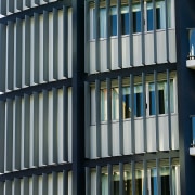 A view of some louvres from Lowline. - architecture, building, commercial building, condominium, daytime, facade, glass, line, metropolis, metropolitan area, structure, tower block, urban area, window, black, gray