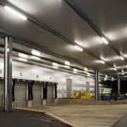 A view of the lighting in the loading airport terminal, ceiling, daylighting, lighting, metropolitan area, parking, parking lot, structure, black, gray