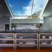 A view of the kitchen, wooden flooring, shelving, countertop, daylighting, interior design, kitchen, gray