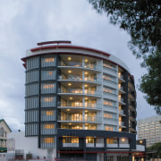 view of the exterior of the HUB apartment apartment, architecture, building, commercial building, condominium, corporate headquarters, facade, headquarters, mixed use, real estate, residential area, sky, tower block, teal, black