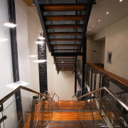A view of the Trends Building. - A apartment, architecture, ceiling, daylighting, handrail, interior design, stairs, wood, black, brown