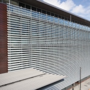 A view of the louvres. - A view architecture, building, commercial building, corporate headquarters, daylighting, facade, headquarters, house, line, metropolitan area, real estate, residential area, roof, siding, structure, window, window covering, gray, black, white