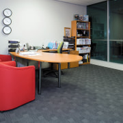 A view of the office furnishings. - A chair, desk, floor, flooring, furniture, interior design, office, product design, table, black, gray