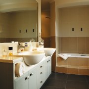 Bathroom with white vanity and basin, glass shower bathroom, bathroom cabinet, cabinetry, countertop, floor, home, interior design, room, sink, tile, brown