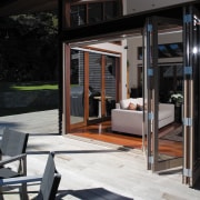 View of decking with bifold aluminium doors leading door, house, window, black