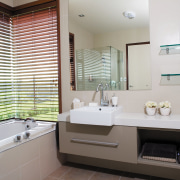 A view of some cabinetry by Carlielle Kitchens. bathroom, home, interior design, real estate, room, sink, window, window covering, gray