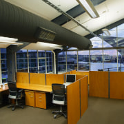 A view of an office by Hawkins Interiors. architecture, ceiling, daylighting, institution, interior design, office, brown