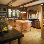 A view of the kitchen, wooden flooring and cabinetry, countertop, cuisine classique, flooring, interior design, kitchen, room, wood, brown, black