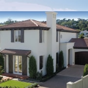 A view of a house by Eden Homes. cottage, elevation, estate, facade, home, house, official residence, property, real estate, residential area, roof, villa, window, gray