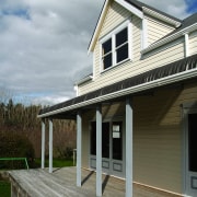 Exterior view of a home which features Palliside cottage, facade, farmhouse, home, house, porch, property, real estate, residential area, roof, siding, window, gray, black