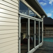 Exterior view of home showing weatherboard cladding and door, facade, house, real estate, siding, window, black, white