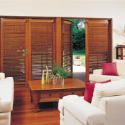 A view of some wooden shutters. - A door, furniture, hardwood, home, interior design, living room, window, window blind, window covering, window treatment, wood, white, red