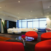 Large open plan apartment showing red chair seating architecture, ceiling, conference hall, interior design, lobby, real estate, room, gray