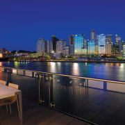view from the sunders wharf apartments looking at apartment, architecture, city, cityscape, condominium, downtown, dusk, evening, home, lighting, metropolis, metropolitan area, night, real estate, reflection, residential area, roof, sky, skyline, skyscraper, tower block, urban area, water, blue, black