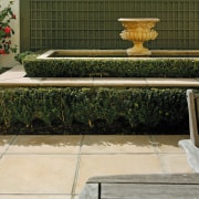 Courtyard with cream pavers and raised water feature flowerpot, furniture, garden, grass, plant, table, wall, brown