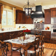 view of this kitchen designed by woodall design cabinetry, countertop, cuisine classique, dining room, hardwood, interior design, kitchen, room, brown