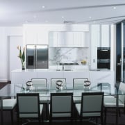 Apartment dining and kitchen area with glass top dining room, interior design, kitchen, living room, real estate, room, table, white, black