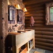 view of the bathroom featuring slate flooring, dual bathroom, home, interior design, room, brown