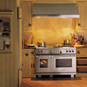 A view of a kitchen with Goldman Associates cabinetry, countertop, cuisine classique, floor, flooring, hardwood, home, home appliance, interior design, kitchen, kitchen appliance, kitchen stove, major appliance, microwave oven, oven, room, under cabinet lighting, brown