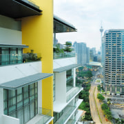 An exterior view of the apartment complex. - apartment, architecture, building, city, commercial building, condominium, corporate headquarters, facade, house, metropolitan area, mixed use, real estate, residential area, window, white