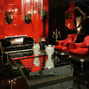 view of the living area featuring red and furniture, interior design, lighting, living room, room, black, red