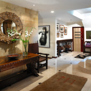 Interior view of entrance area of home, with ceiling, floor, flooring, interior design, living room, lobby, room, brown, gray