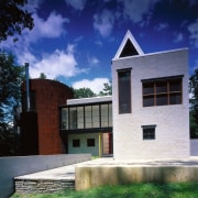 Exterior view of architecturally designed home, with block architecture, building, daytime, estate, facade, home, house, real estate, residential area, sky, window, blue, black