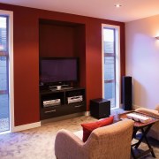 View of home theatre room with armchairs and home, interior design, living room, real estate, room, suite, red