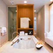 view of the bathroom featuring rift oak cabinetry, bathroom, interior design, real estate, room, suite, gray