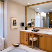 view of the bathroom featuring rift oak cabinetry, bathroom, bathroom accessory, interior design, room, gray