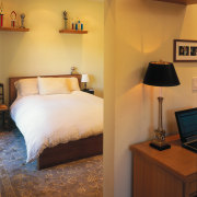 A view of a home by Hedgpeth Architects. bed, bed frame, bedroom, ceiling, floor, furniture, home, interior design, room, suite, wall, orange, brown