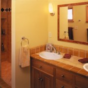 A view of a home by Hedgpeth Architects. bathroom, bathroom accessory, cabinetry, floor, home, property, room, orange, brown