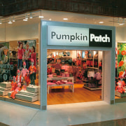 view of the pumpkin pathc store designed by boutique, display case, display window, exhibition, outlet store, retail, brown, black