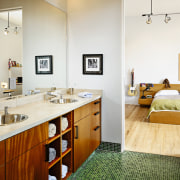 view of the bathroom featuring timber veneer cabinetry, bathroom, countertop, floor, home, interior design, room, white