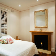 A viewof a bedroom, wooden flooring and fireplace, bedroom, ceiling, furniture, home, interior design, property, real estate, room, suite, window, window covering, brown, gray