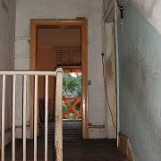 An interior view of the apartmnt befor eit door, home, house, property, stairs, wall, window, wood, gray