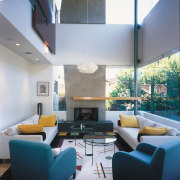 view of the interior of this home featuring architecture, ceiling, daylighting, house, interior design, interior designer, living room, loft, real estate, room, table, gray, black