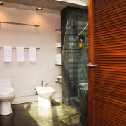 A view of a bathroom designed by David bathroom, floor, flooring, home, interior design, room, wall, brown, white