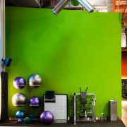 view of the les mills gym area featuring interior design, room, structure, green