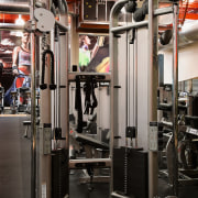 A view of some fitness equipment from Life exercise machine, gym, room, sport venue, structure, weight training, black, gray