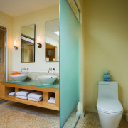 A view of the Bathroom featuring tiled flooring/walls, architecture, bathroom, floor, home, house, interior design, plumbing fixture, room, brown, gray