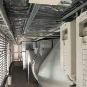 A view of a air conditioning system by gray, black