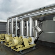 A view of a air conditioning system by machine, black, white, gray