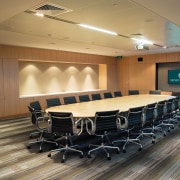 A view of the AirNZ building. - A auditorium, ceiling, conference hall, convention center, floor, flooring, function hall, interior design, table, brown