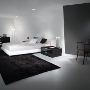 Bedroom with white bed and bedding, black rug, architecture, bed, bed frame, bedroom, black and white, floor, furniture, interior design, product design, room, table, wall, gray, black