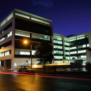 An exterior view of the AirNZ building. - apartment, architecture, building, city, commercial building, condominium, corporate headquarters, evening, facade, headquarters, home, hotel, house, lighting, metropolis, metropolitan area, mixed use, neighbourhood, night, property, real estate, residential area, sky, window, black, blue